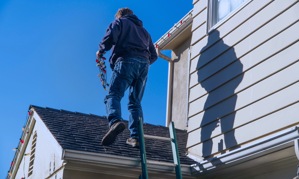 2 Image of a young girl with brown hair high-fiving her female doctor during a medical appointment, with her mother watching and smiling. The setting is a modern doctor's office, illustrating a supportive and positive healthcare environment for children. The doctor is dressed in a white lab coat, suggesting a professional and caring interaction.