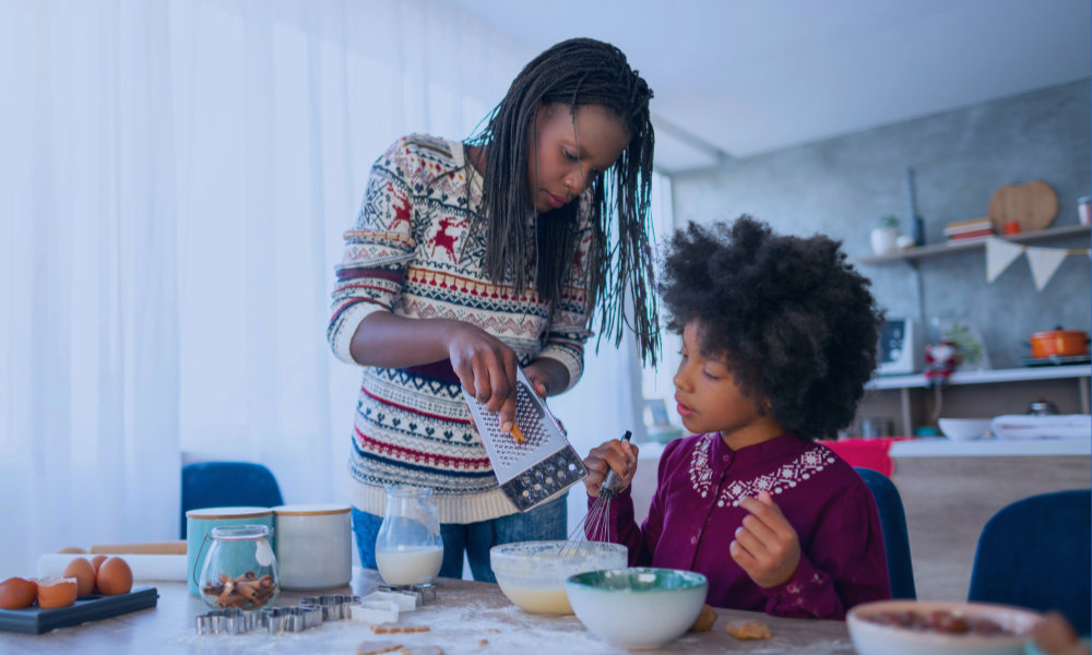 3 Image of a young girl receiving a medical examination from a nurse using a digital thermometer, while her mother closely watches. The nurse, in blue scrubs, is attentively engaging with the child, who appears calm. The mother, standing beside her daughter, looks on with concern. The setting is a medical office, illuminated in a serene blue tone to create a calm and professional atmosphere.