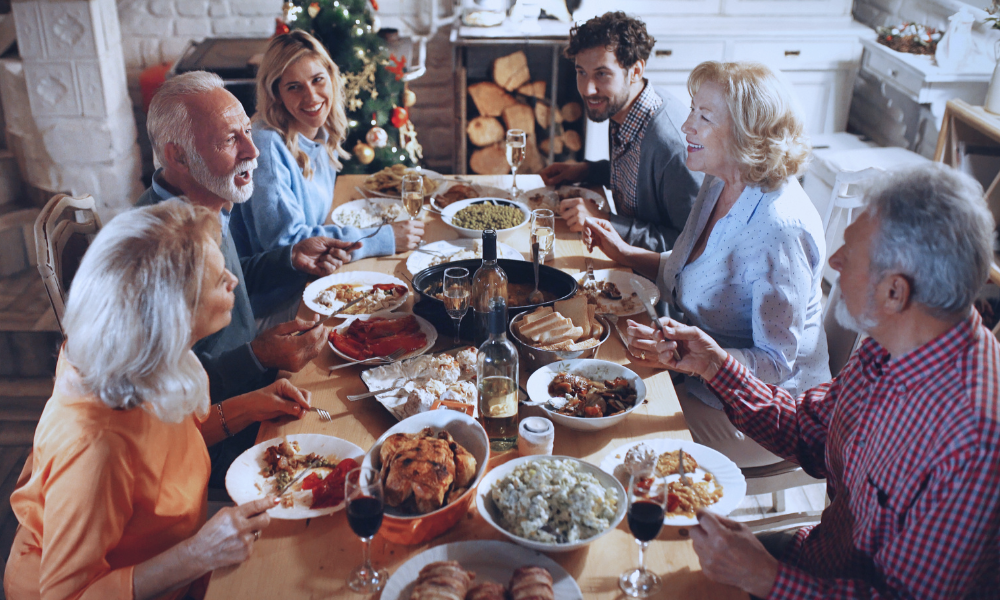 4 Image of a young boy in a hospital bed hugging his nurse in a comforting embrace. The nurse, wearing a light blue uniform, smiles warmly at the child, expressing care and support. They are in a brightly lit hospital room with large windows in the background, adding a serene and hopeful atmosphere to the scene.