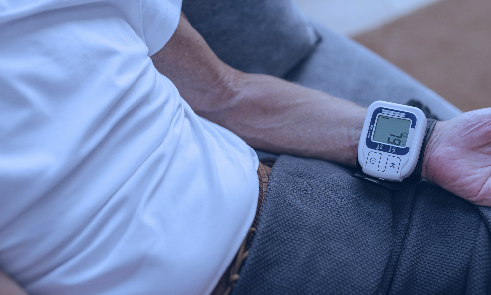 Image of a young girl receiving a medical examination from a nurse using a digital thermometer, while her mother closely watches. The nurse, in blue scrubs, is attentively engaging with the child, who appears calm. The mother, standing beside her daughter, looks on with concern. The setting is a medical office, illuminated in a serene blue tone to create a calm and professional atmosphere.