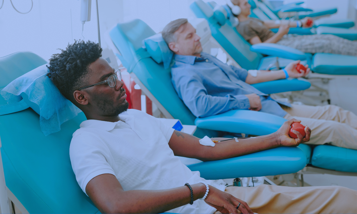 Image of a young girl with brown hair high-fiving her female doctor during a medical appointment, with her mother watching and smiling. The setting is a modern doctor's office, illustrating a supportive and positive healthcare environment for children. The doctor is dressed in a white lab coat, suggesting a professional and caring interaction.
