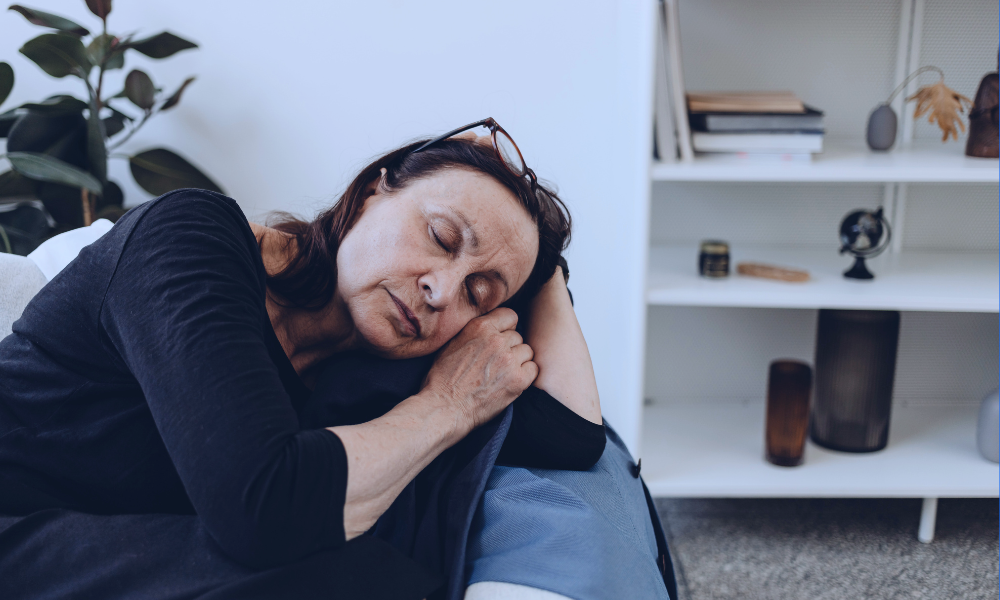 Image of a young girl with brown hair high-fiving her female doctor during a medical appointment, with her mother watching and smiling. The setting is a modern doctor's office, illustrating a supportive and positive healthcare environment for children. The doctor is dressed in a white lab coat, suggesting a professional and caring interaction.